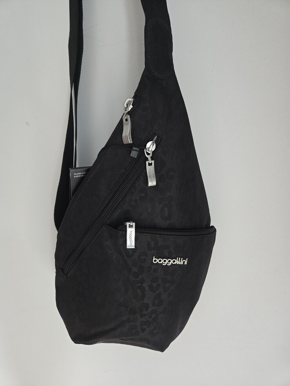 New BAGGALLINI Mini Sling - Black Cheetah Emboss